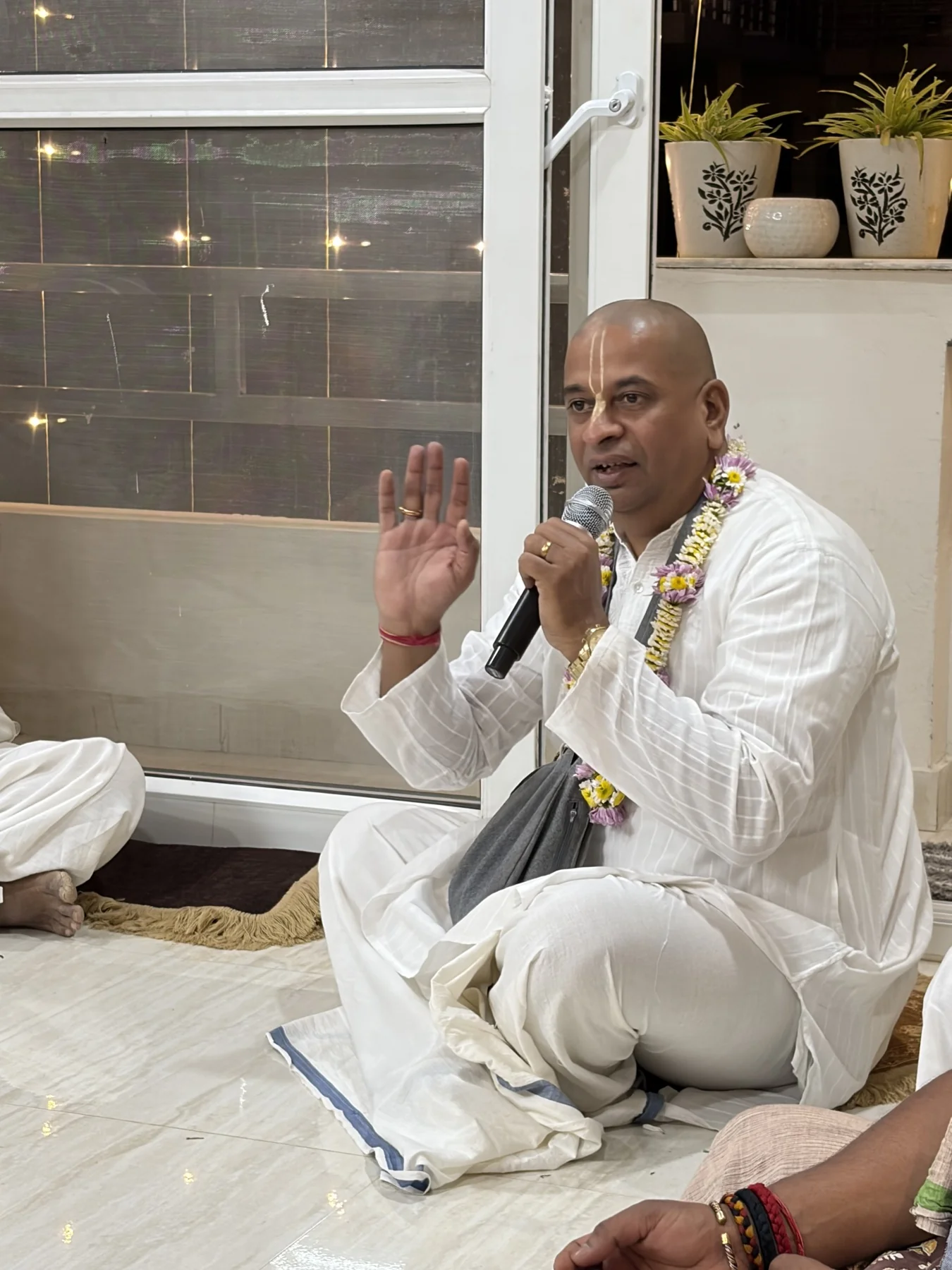 Caitanya Avatāri Dāsa speaking during a small gathering