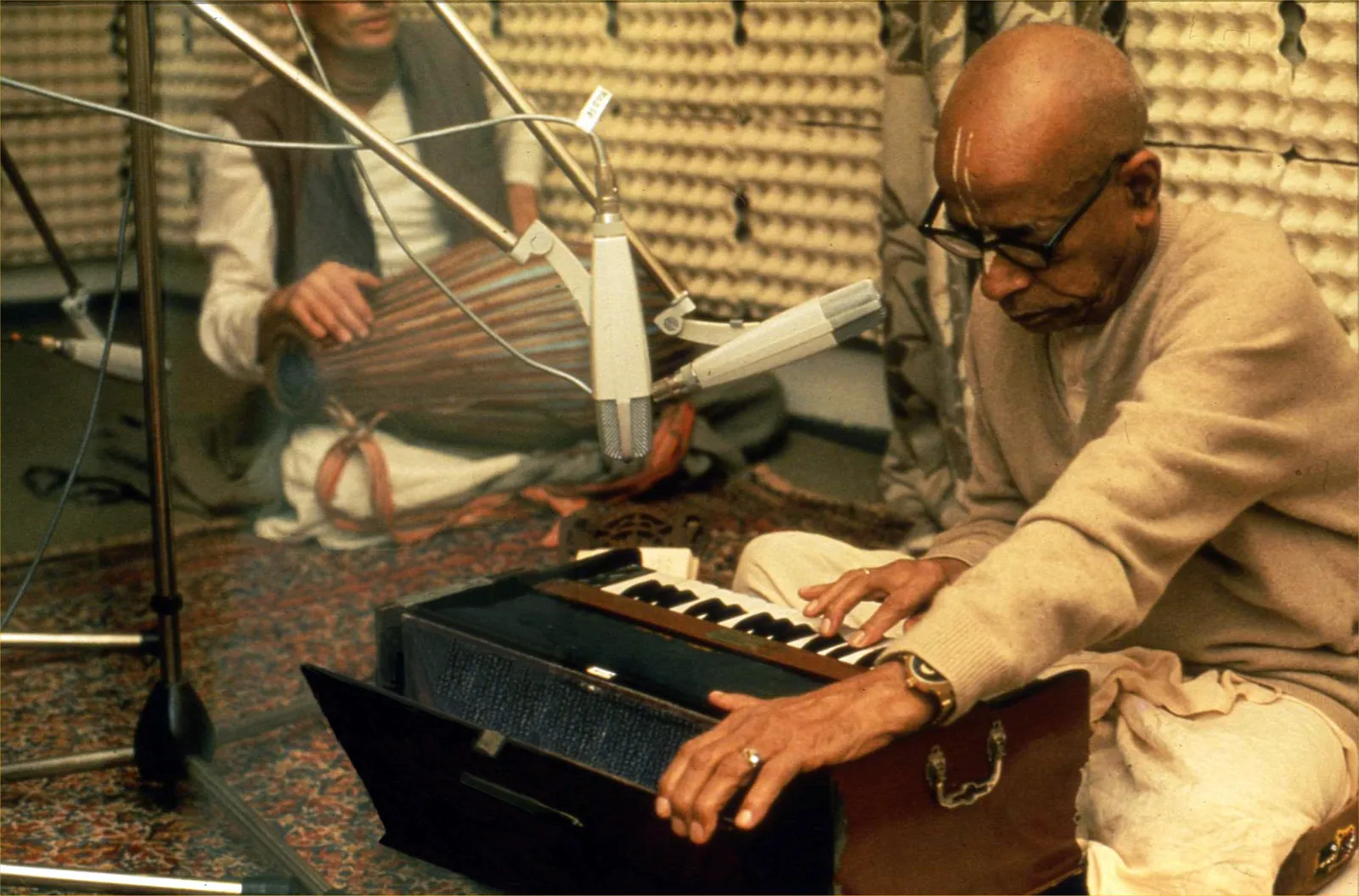 Śrīla Prabhupāda playing harmonium in a recording studio in Germany in 1974